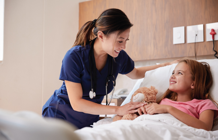 Nurse Checking on Young Patient