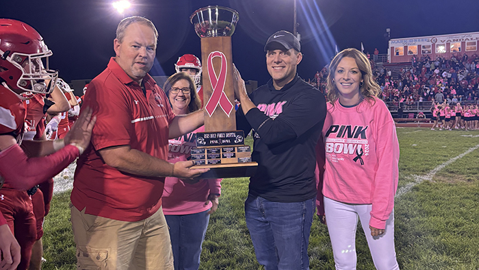 Michael Janis, Chief Operating Officer of HSHS Southern Illinois Market, and Teresa Cornelius, Chief Administrative Officer of HSHS Holy Family Hospital (both on right), presents the ‘Pink Bowl’ troph