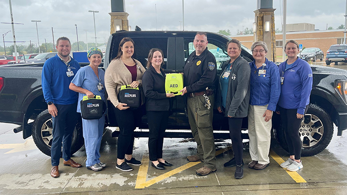 Officer John LeCroy (center) of the Aviston Police Department. Left to right: Alex Vandeloo, Danielle Trame, Mandy Ocepek, Mandi Ennen, Officer LeCroy, Serra Morton, Sister Pam Falter and Jessa Book.