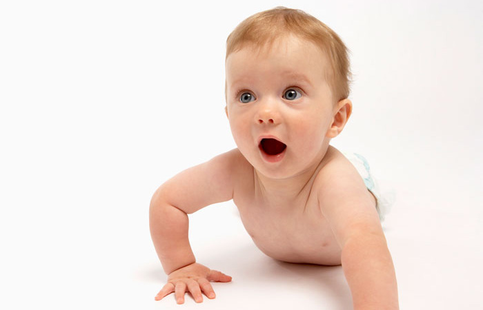 Baby crawling on white floor