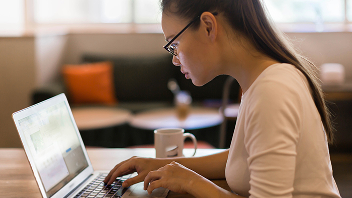 Young woman at laptop computer