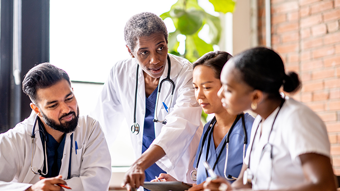 Physician's leading a group discussion